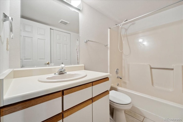 full bath with visible vents, washtub / shower combination, toilet, tile patterned floors, and vanity