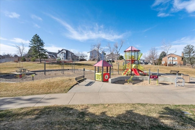 community playground featuring a lawn