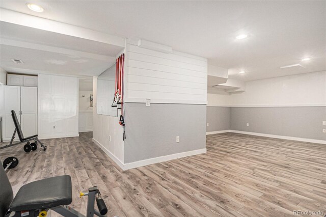 workout room with recessed lighting, wood finished floors, and baseboards