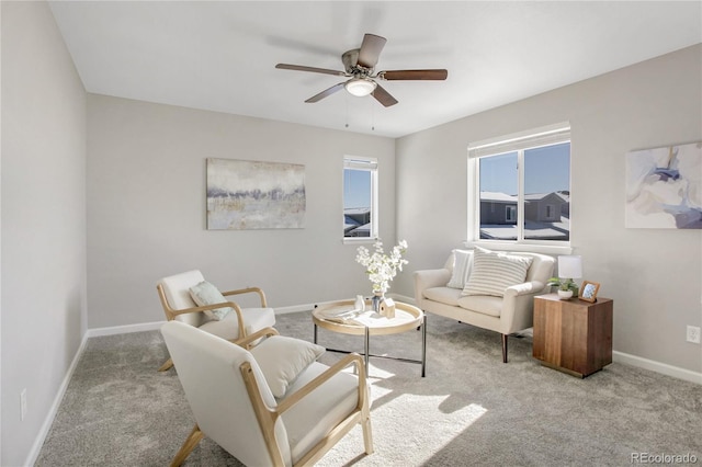 living room featuring light carpet and ceiling fan