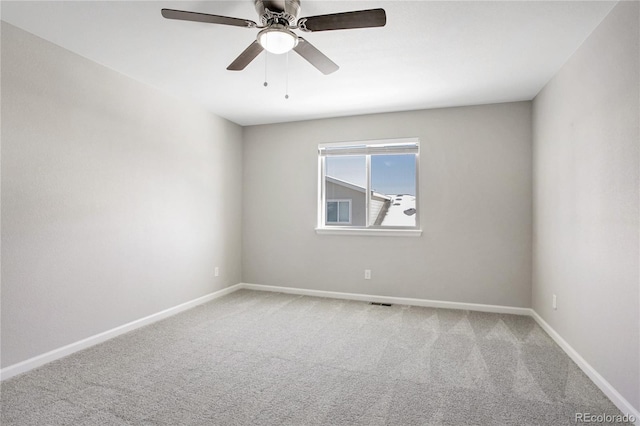 unfurnished room with carpet floors and ceiling fan