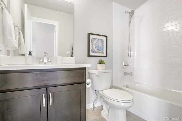 full bathroom featuring tile patterned floors, vanity, toilet, and tiled shower / bath combo