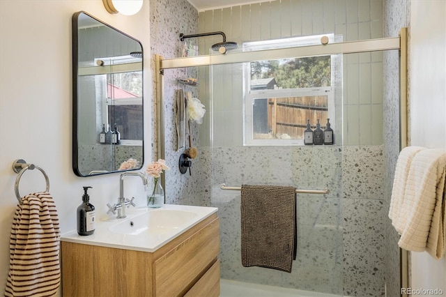 full bathroom with vanity and walk in shower