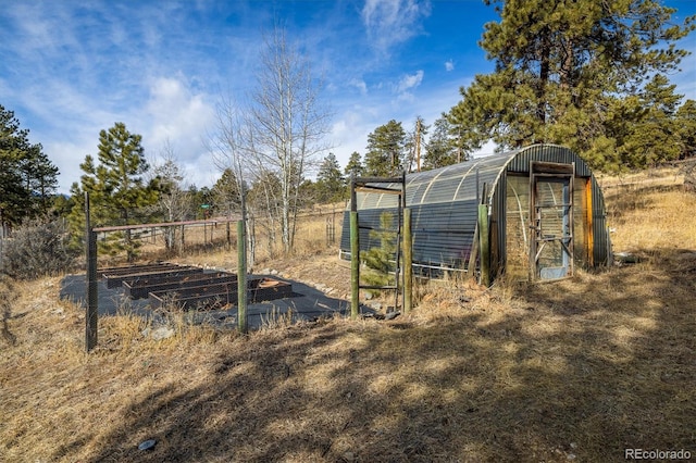 view of outbuilding with a garden