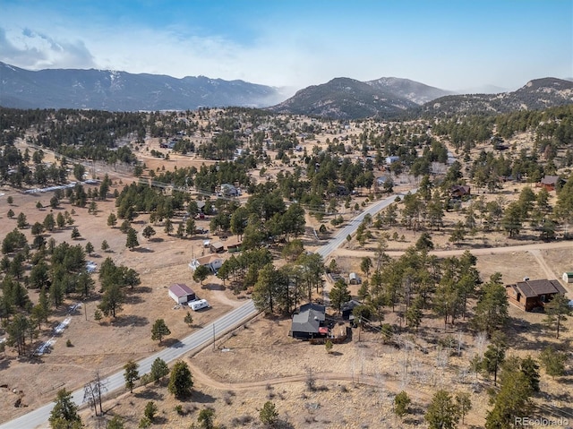 birds eye view of property featuring a mountain view