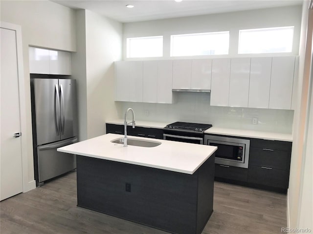 2865 W 24th Ave, Denver, CO 80211 - kitchen with appliances with stainless steel finishes, modern cabinets, white cabinetry, light countertops, and recessed lighting