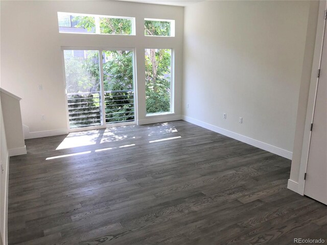 2865 W 24th Ave, Denver, CO 80211 - spare room with plenty of natural light and dark wood finished floors