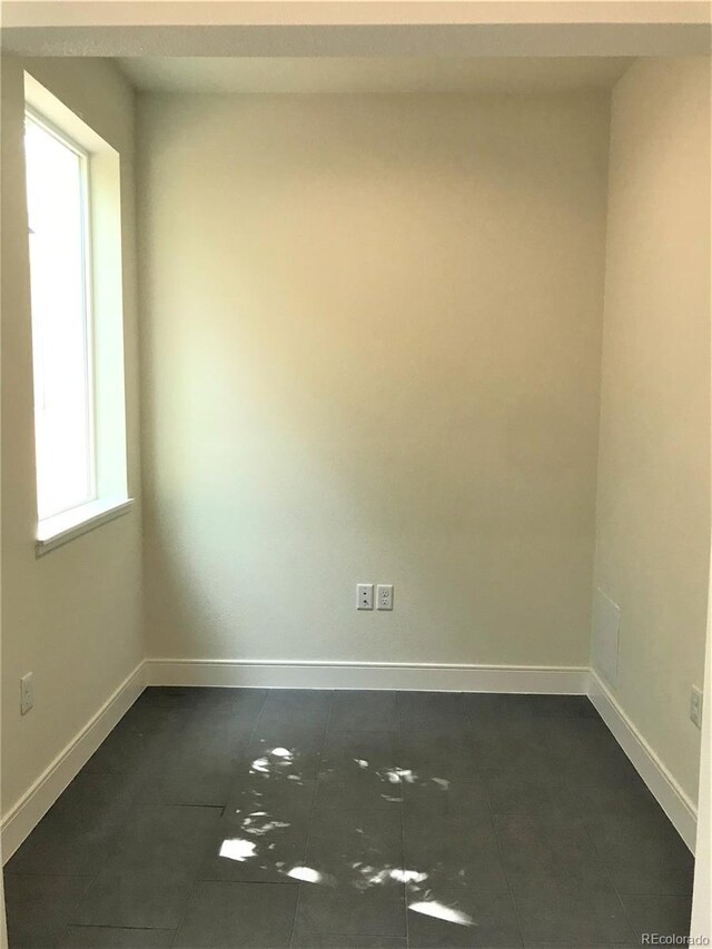 2865 W 24th Ave, Denver, CO 80211 - spare room with dark tile patterned flooring