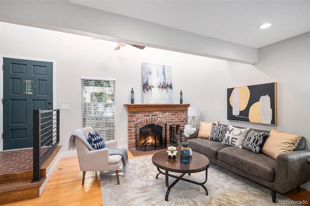 2882 W Long Cir Unit H, Littleton, CO 80120 - living area with light wood-type flooring, a fireplace, a ceiling fan, and recessed lighting