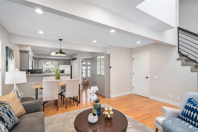 2882 W Long Cir Unit H, Littleton, CO 80120 - living room with light wood-style floors, stairs, and recessed lighting