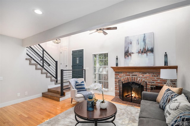 2882 W Long Cir Unit H, Littleton, CO 80120 - living area with stairs, light wood-style floors, a fireplace, recessed lighting, and ceiling fan