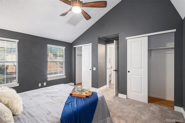 2882 W Long Cir Unit H, Littleton, CO 80120 - carpeted bedroom with multiple closets, vaulted ceiling, and a ceiling fan
