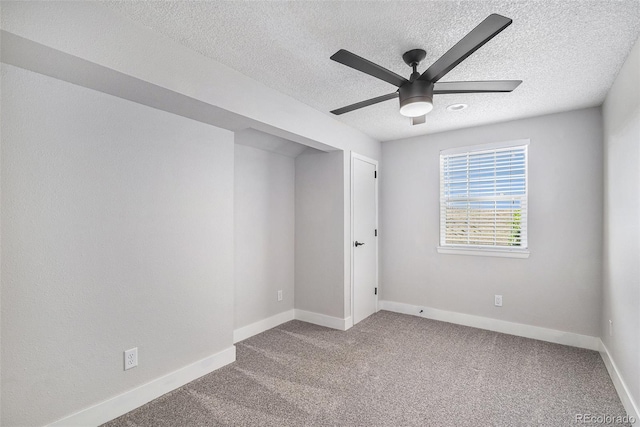 2882 W Long Cir Unit H, Littleton, CO 80120 - unfurnished room featuring a textured ceiling, a ceiling fan, and carpet flooring