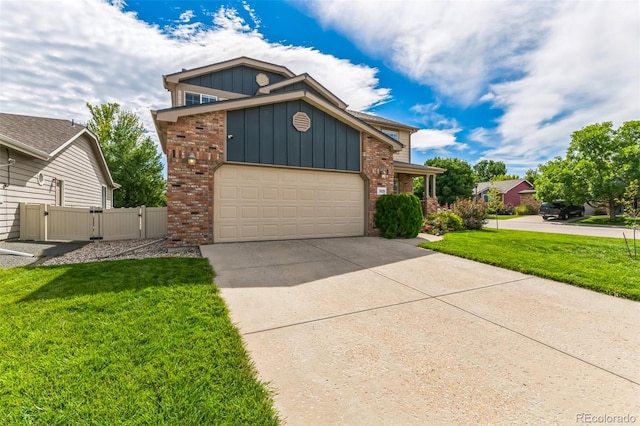 view of front of home with a garage and a front lawn