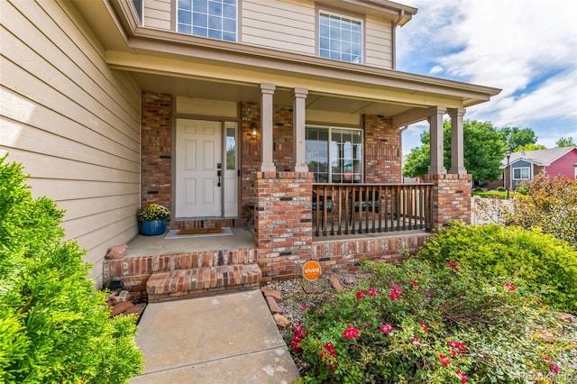 property entrance featuring a porch