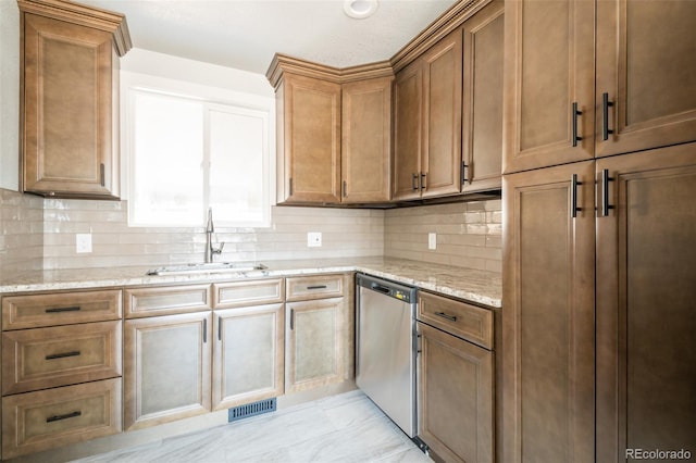 kitchen with visible vents, light stone counters, backsplash, stainless steel dishwasher, and a sink