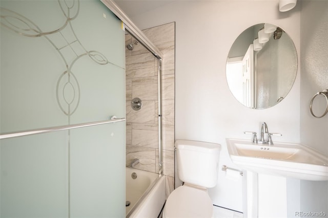 full bathroom featuring enclosed tub / shower combo and toilet