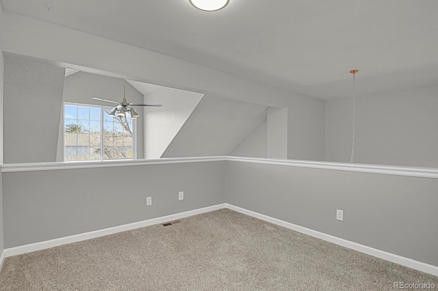 additional living space with ceiling fan, carpet floors, and lofted ceiling