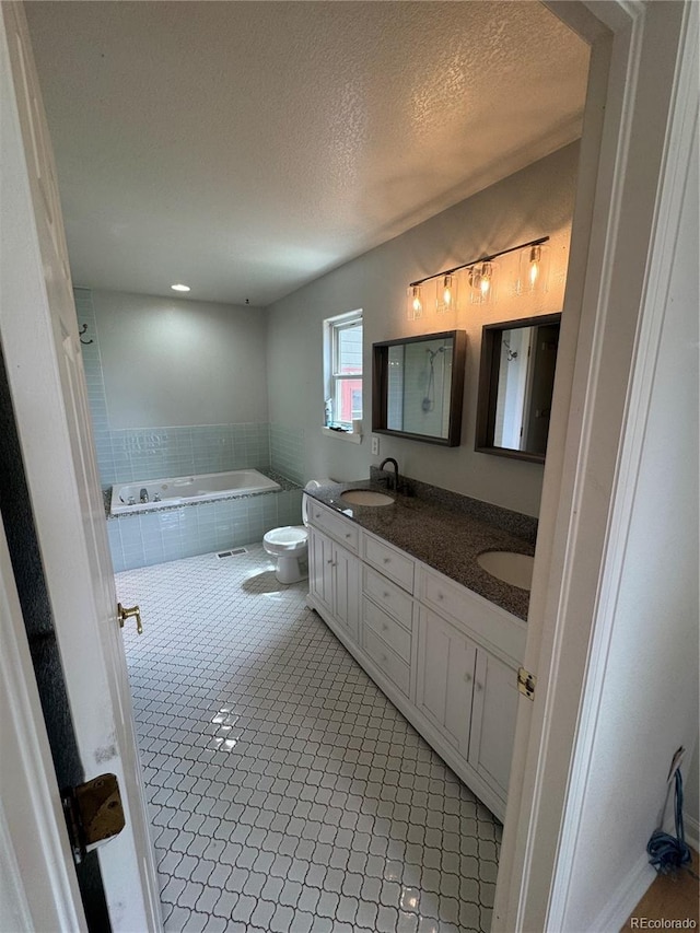 11549 Haskell Creek Rd, Larkspur, CO 80118 - full bath featuring a bath, double vanity, a textured ceiling, toilet, and tile patterned floors