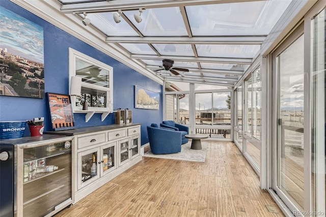 11549 Haskell Creek Rd, Larkspur, CO 80118 - sunroom with a ceiling fan, beverage cooler, and track lighting