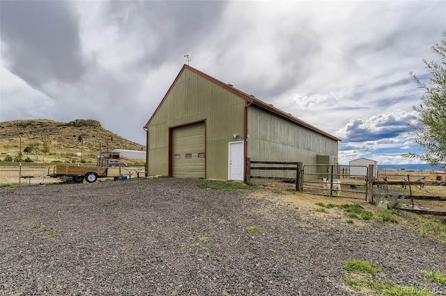 11549 Haskell Creek Rd, Larkspur, CO 80118 - view of pole building featuring a gate and a mountain view