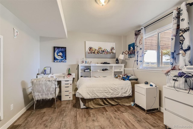 11549 Haskell Creek Rd, Larkspur, CO 80118 - bedroom featuring wood finished floors and baseboards