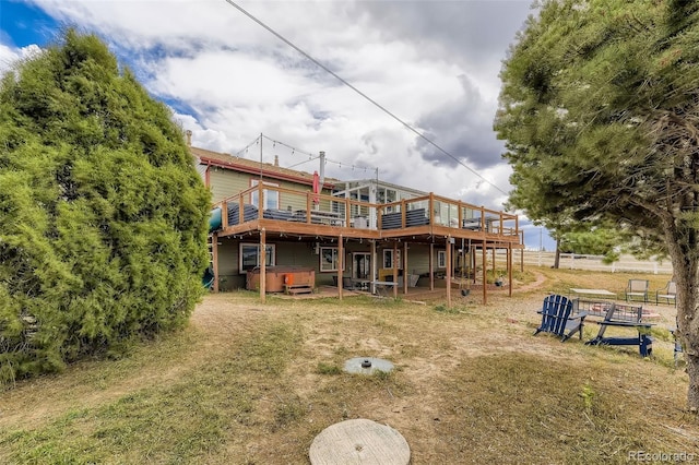 11549 Haskell Creek Rd, Larkspur, CO 80118 - rear view of house featuring a hot tub and a deck