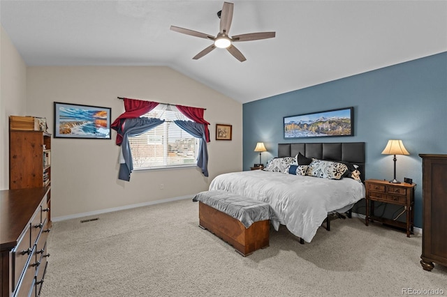 carpeted bedroom featuring ceiling fan and vaulted ceiling