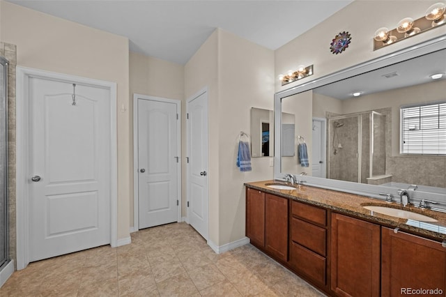 bathroom featuring vanity and a shower with shower door