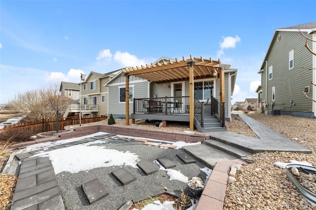 rear view of house with a pergola