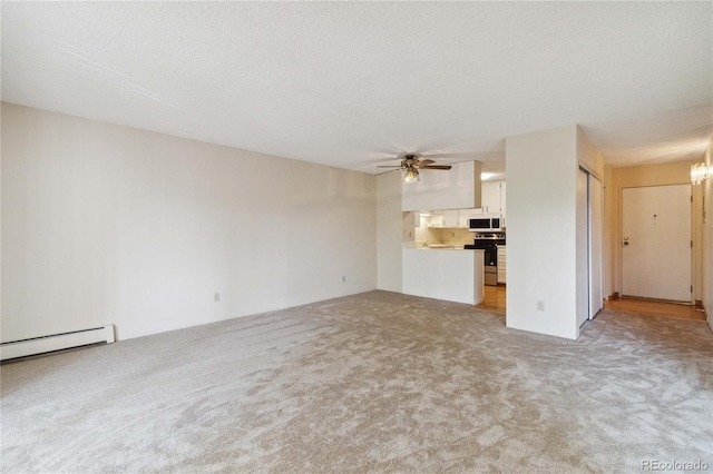 unfurnished living room featuring light carpet, ceiling fan, a baseboard heating unit, and a textured ceiling