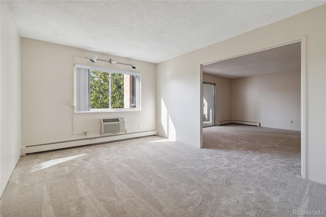 unfurnished room featuring light colored carpet, a textured ceiling, and a baseboard radiator