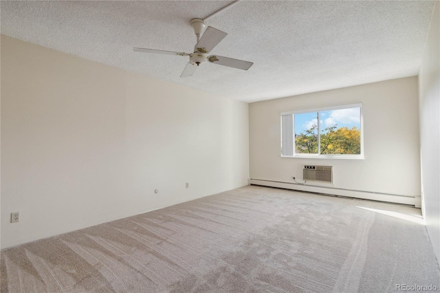 carpeted empty room with ceiling fan, an AC wall unit, a baseboard heating unit, and a textured ceiling