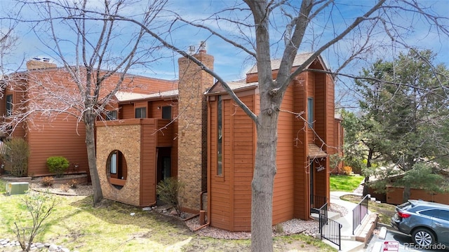 4803 Daybreak Cir, Colorado Springs, CO 80917 - view of front of home with brick siding and a chimney
