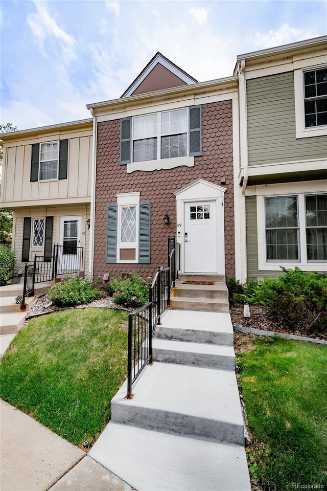 1699 S Trenton St Unit 69, Denver, CO 80231 - townhome / multi-family property featuring a front yard