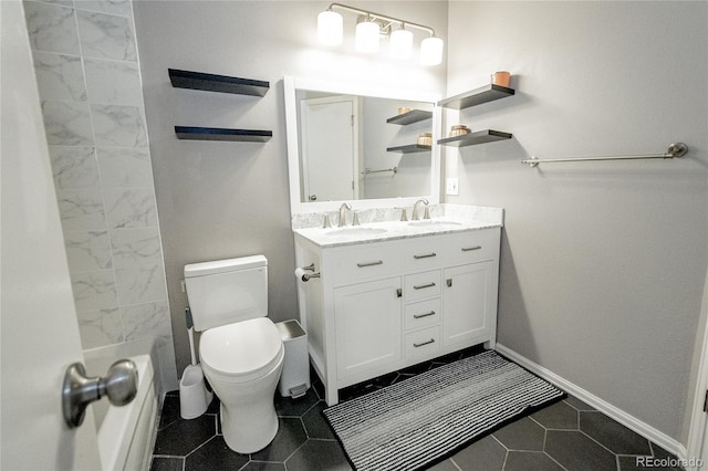 1699 S Trenton St Unit 69, Denver, CO 80231 - full bathroom featuring toilet and double vanity