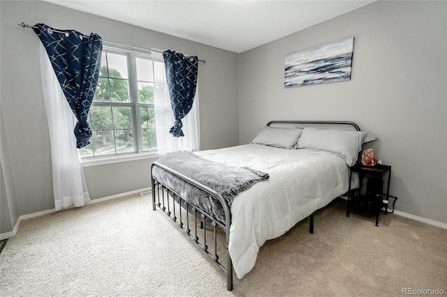 1699 S Trenton St Unit 69, Denver, CO 80231 - bedroom featuring carpet and baseboards