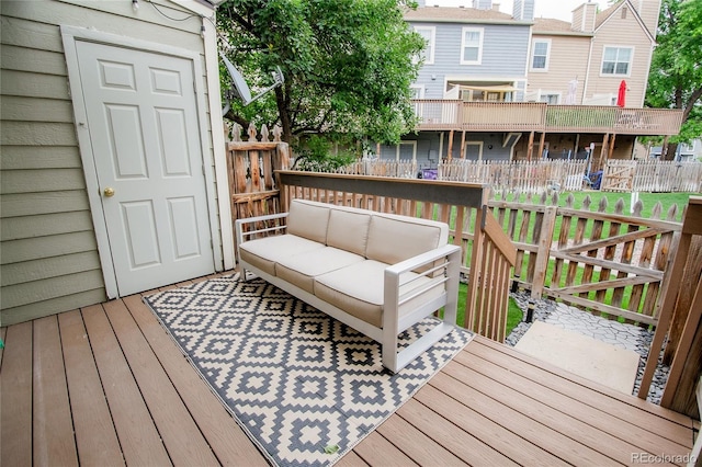 1699 S Trenton St Unit 69, Denver, CO 80231 - wooden deck featuring an outdoor hangout area