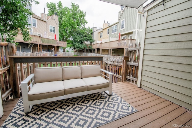 1699 S Trenton St Unit 69, Denver, CO 80231 - wooden terrace featuring an outdoor hangout area and a residential view