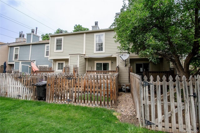 1699 S Trenton St Unit 69, Denver, CO 80231 - back of house with a chimney