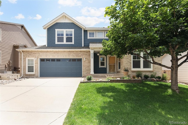 4488 Larksong Pl, Castle Rock, CO 80109 - craftsman house with driveway, a front yard, brick siding, and an attached garage
