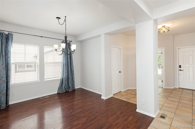 4488 Larksong Pl, Castle Rock, CO 80109 - spare room featuring a chandelier and wood finished floors