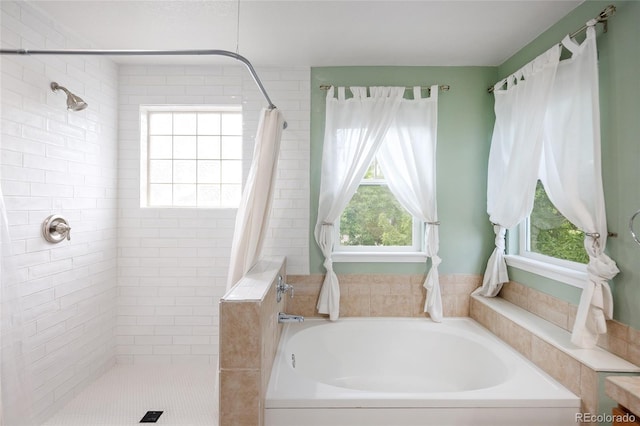 4488 Larksong Pl, Castle Rock, CO 80109 - bathroom featuring plenty of natural light, a tile shower, and a garden tub