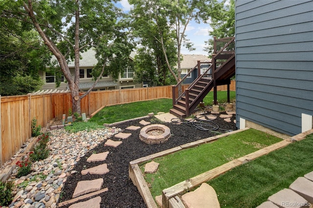 4488 Larksong Pl, Castle Rock, CO 80109 - fenced backyard featuring a fire pit and stairway