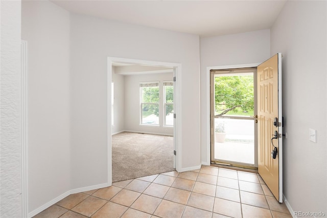 4488 Larksong Pl, Castle Rock, CO 80109 - doorway to outside featuring light colored carpet and light tile patterned flooring