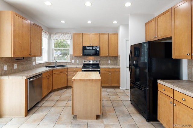 4488 Larksong Pl, Castle Rock, CO 80109 - kitchen featuring black appliances, decorative backsplash, a center island, recessed lighting, and wood counters