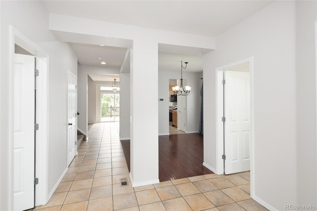 4488 Larksong Pl, Castle Rock, CO 80109 - hall featuring a chandelier, light tile patterned floors, and recessed lighting