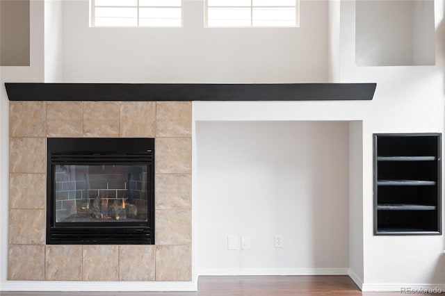 4488 Larksong Pl, Castle Rock, CO 80109 - detailed view of wood finished floors and a tiled fireplace