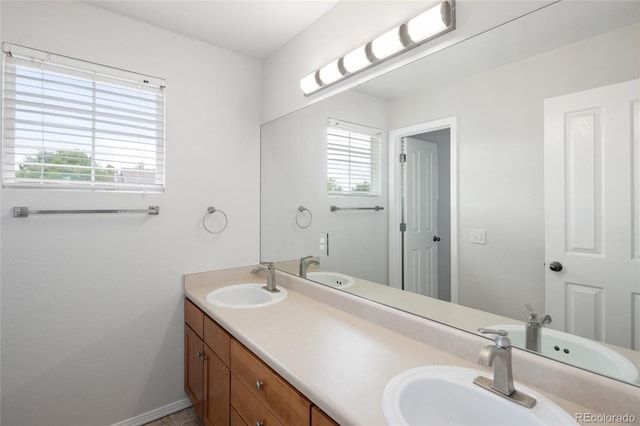 4488 Larksong Pl, Castle Rock, CO 80109 - bathroom featuring double vanity and healthy amount of natural light