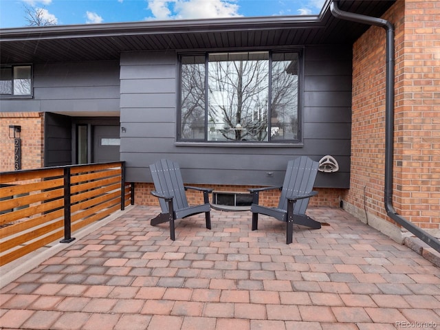 view of patio / terrace with an outdoor fire pit